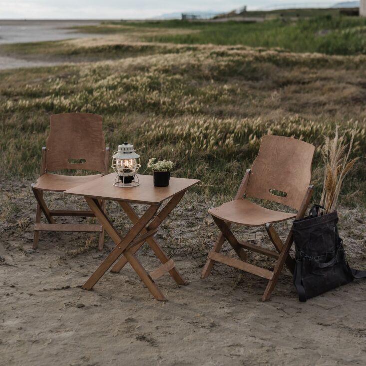 From Barebones, good-looking dine-anywhere furniture: the compact Ridgetop Wood Folding Chair is &#8\2\20;inspired by antique school and church folding chairs historically used indoors&#8\230;reimagined for outdoor use&#8\2\2\1;. It&#8\2\17;s made from hardwood birch, stainless steel, and copper details; \$\149.99 each. Pair with the Ridgetop Wood Folding Table, also \$\149.99.