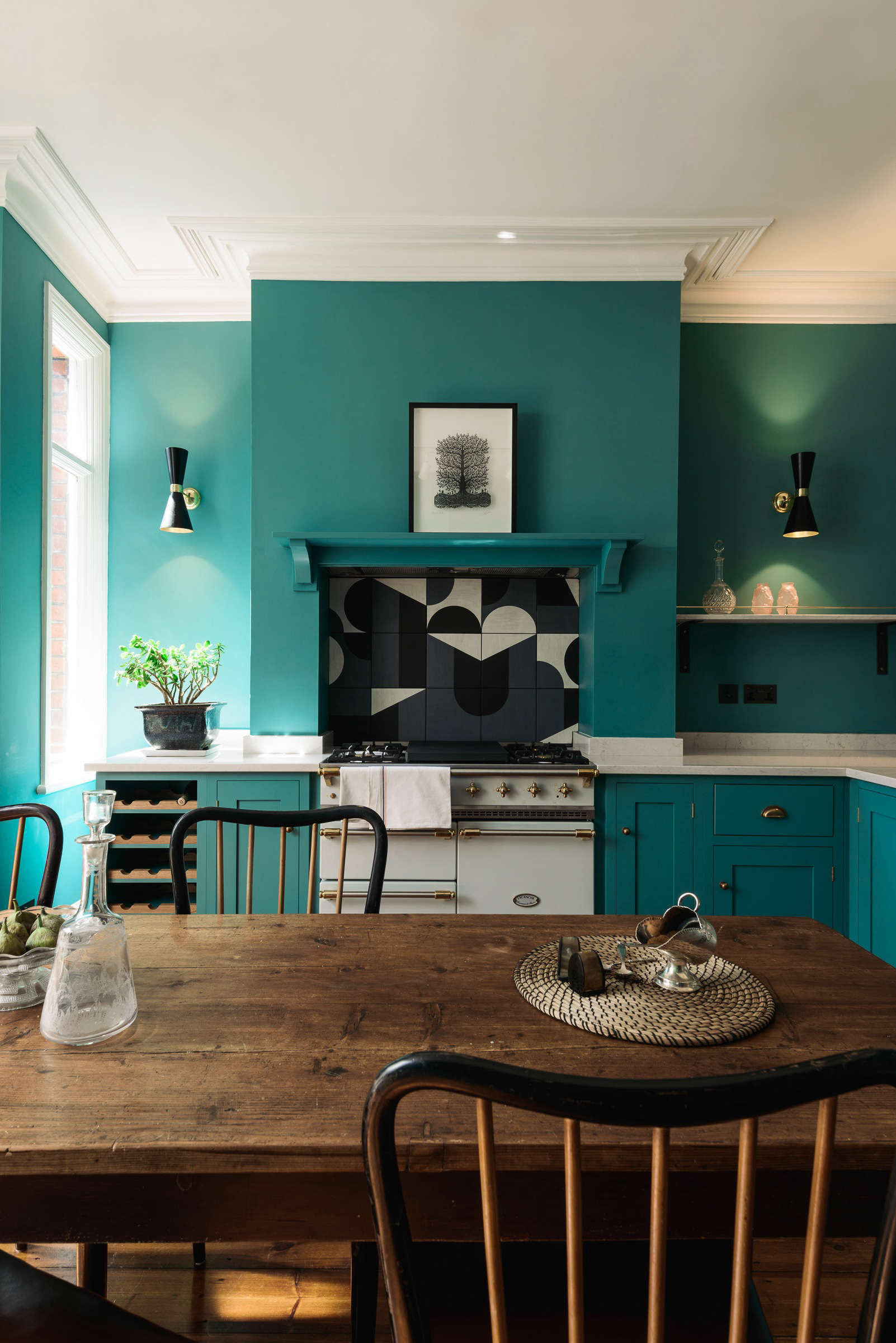 Shaker-style deVol kitchen in London with statement tiled backsplash