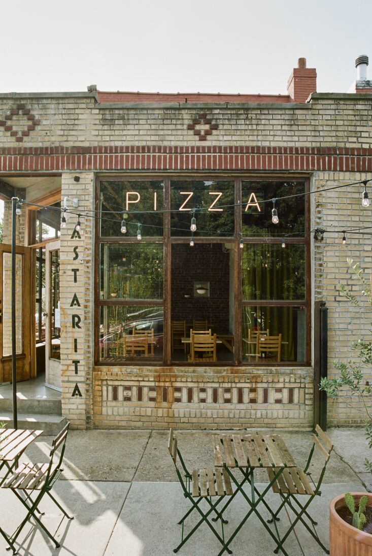 the astarita is located in a 1931 yellow brick building that anchors a sunny  12