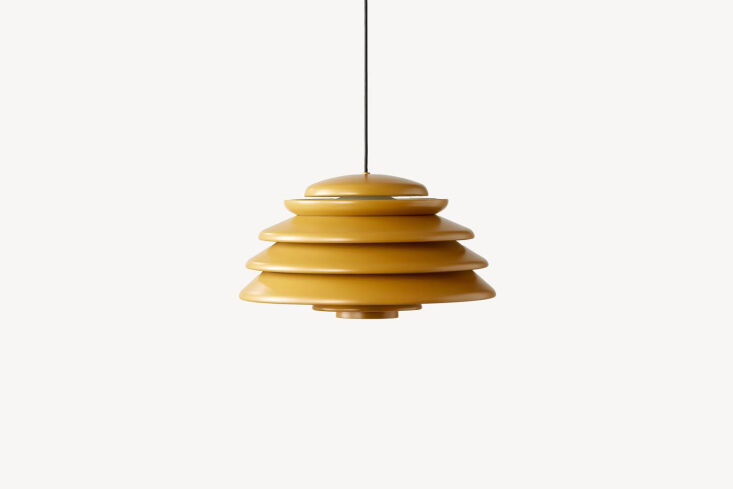 hanging above the kitchen sink is the verpan hive pendant in yellow; starting a 28