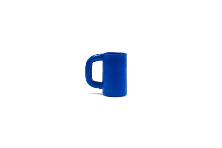 the workaday handmade tall mug blue is \$44 at workaday. 31