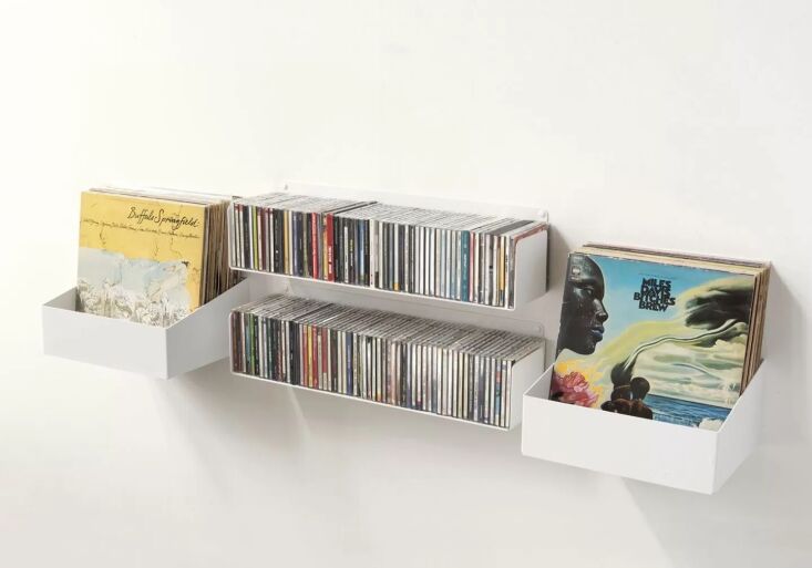 unobtrusive floating shelves work well for storing cds—and offer limitle 18