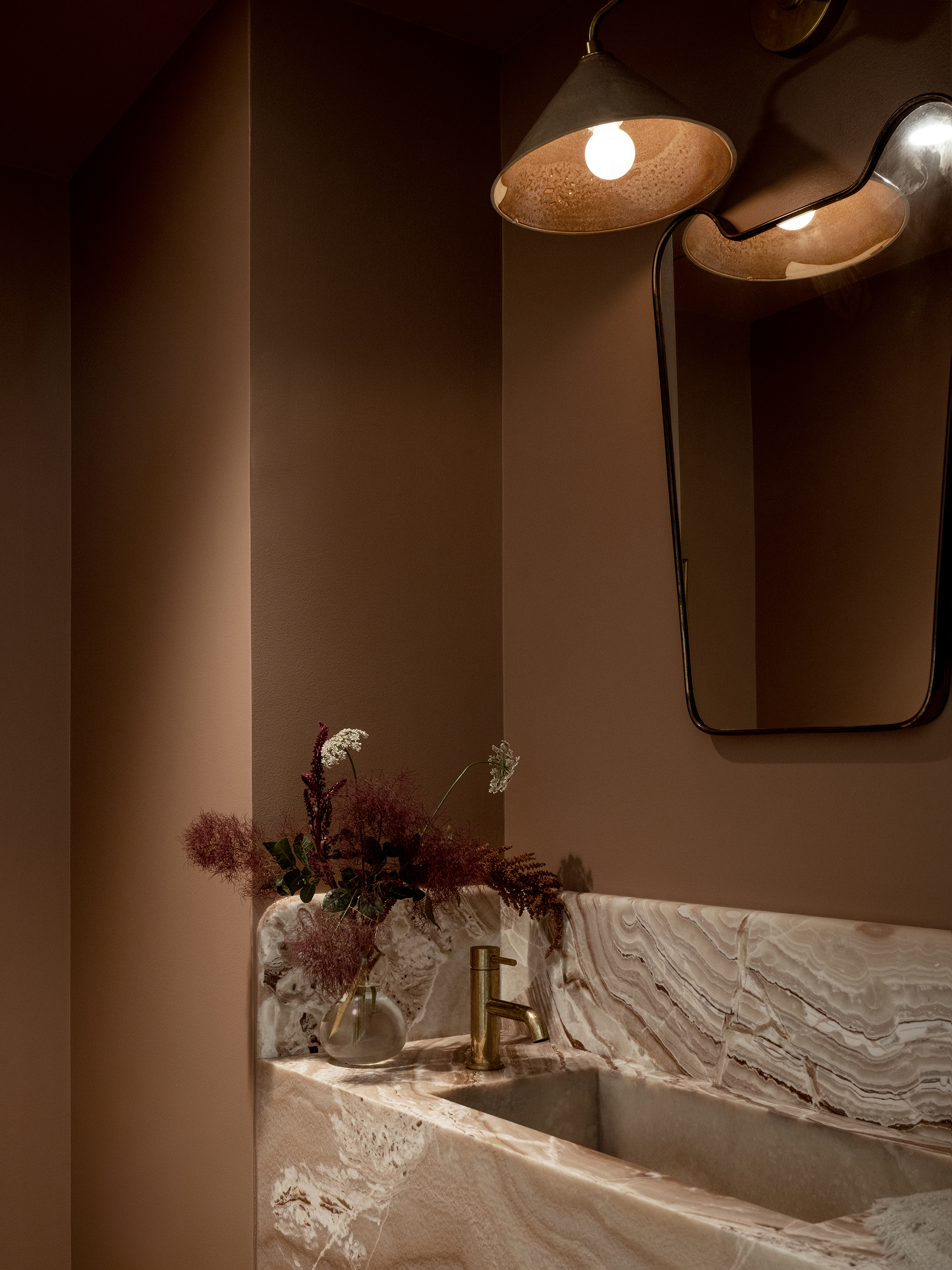 the powder room is painted colorado clay by benjamin moore and has a sink of re 28