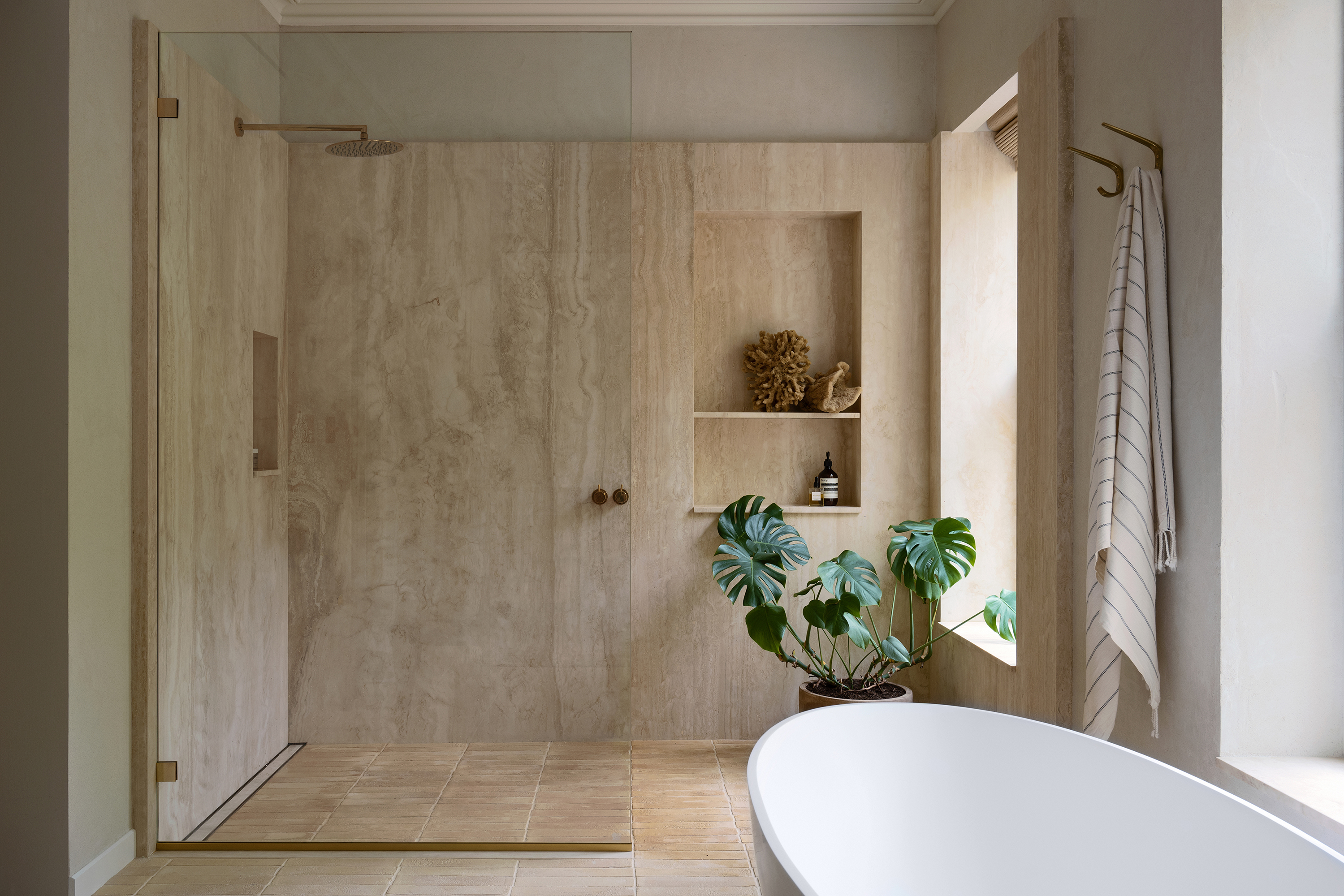 &#8\2\20;slabs of navona travertine are built out at one end of the bath to 35
