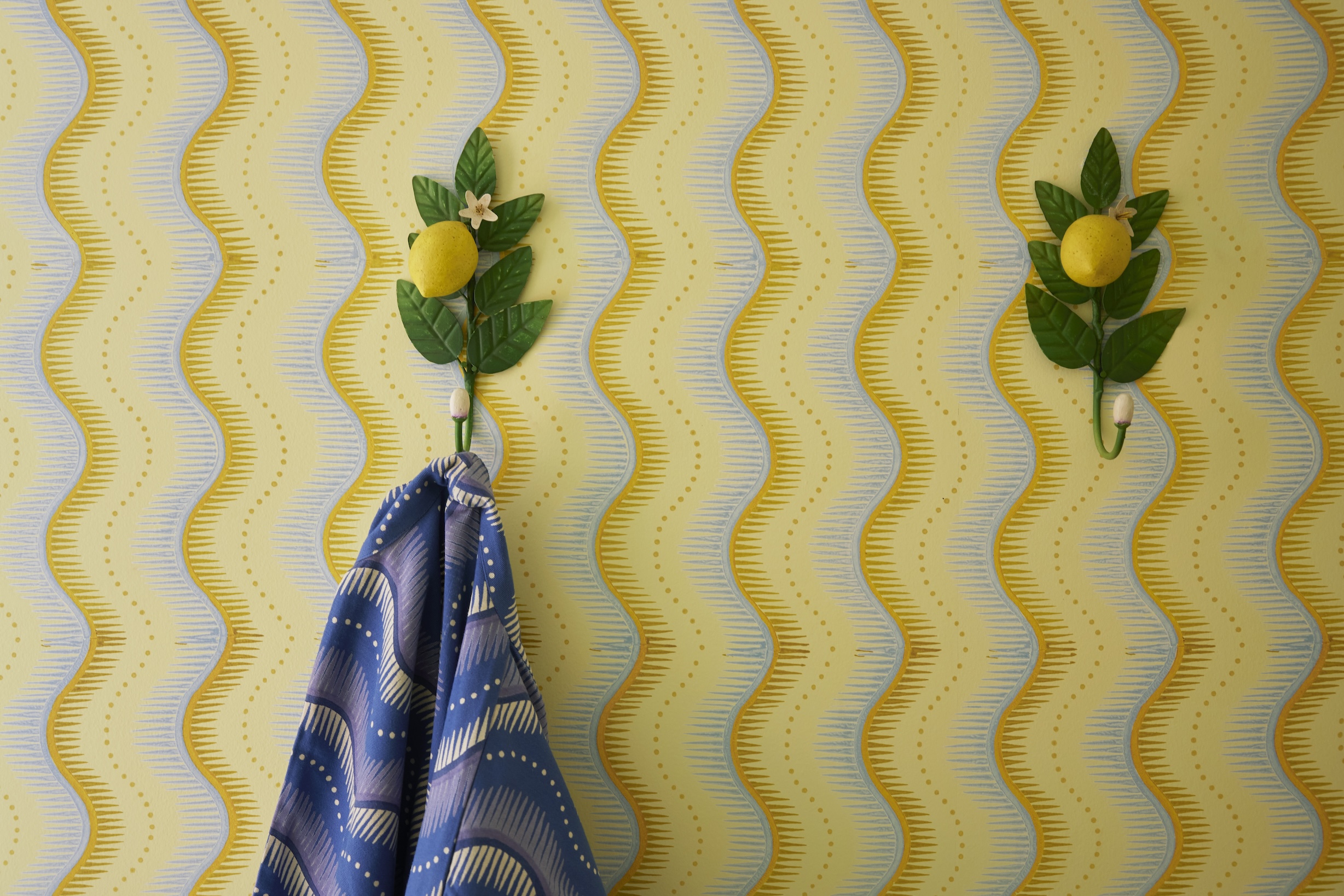 vintage tole hooks hang on little zipper wallpaper. “our patterns are a  24