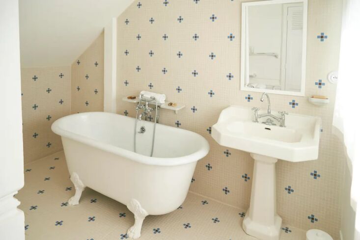 the main bathroom is designed with vintage fixtures. the cast iron clawfoot tub 25