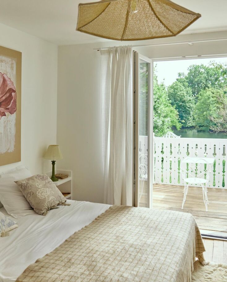 the main bedroom is designed with textiles ranging from curtains made from line 24
