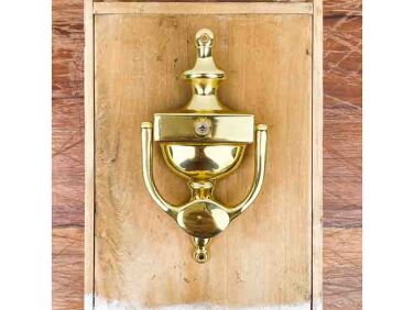 door knocker with polished brass peephole  