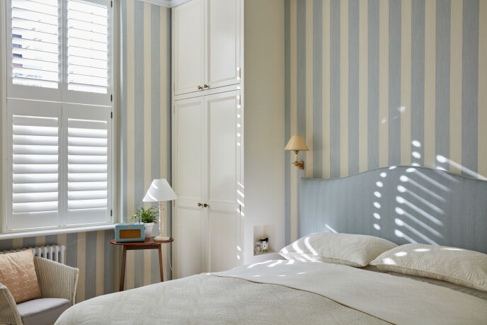 bedroom with striped wallpaper 36