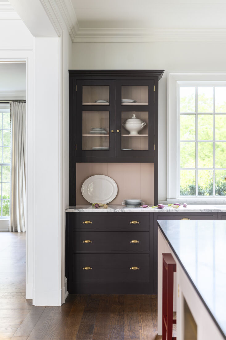 The cabinet-like countertop cabinets are finished in plain English.