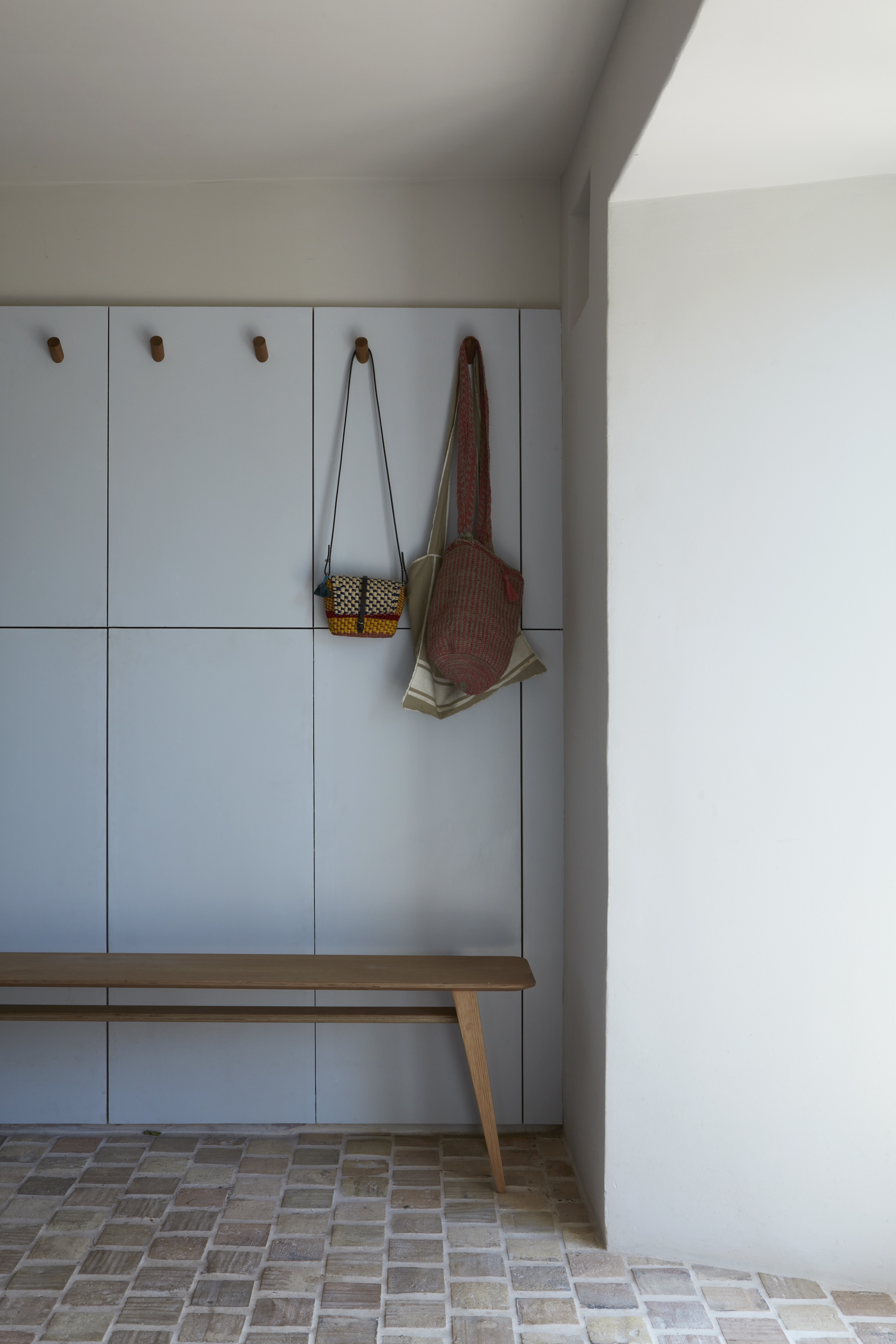 tuckey design studio fitted the entrance hall/boot room with painted wood cabin 19