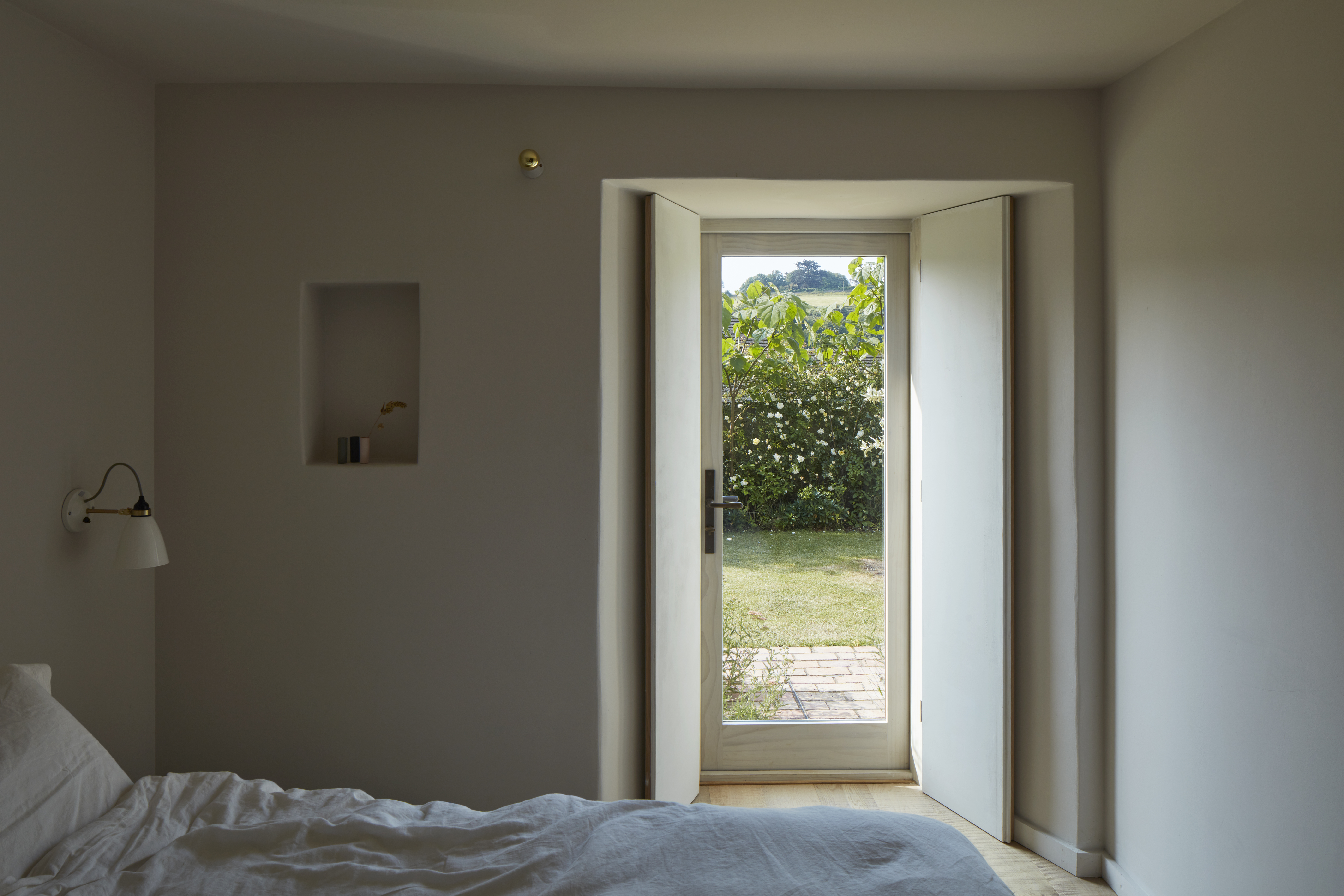 the rooms all have glazed doors that open to the garden and were designed to ha 29