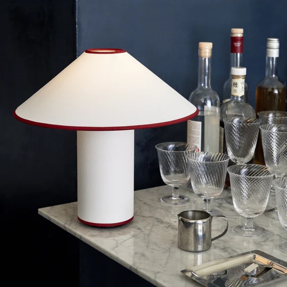 the &tradition colette table lamp with subtle red edging is \$565 from allm 22