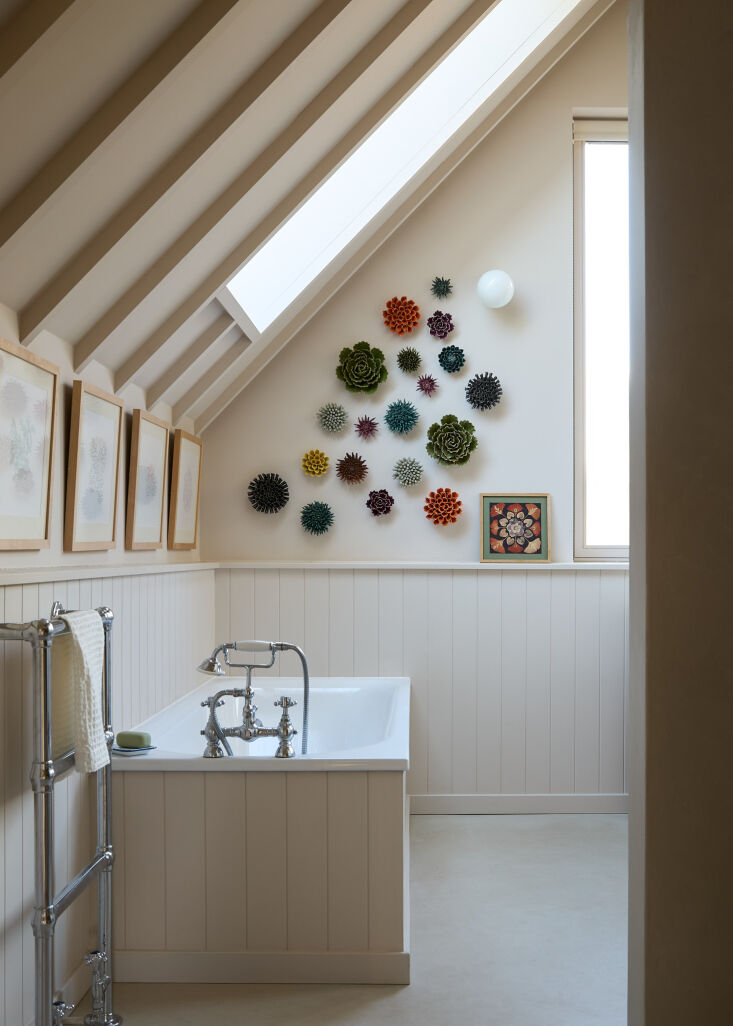 george installed wainscoting in all three bathrooms. the tub in the primary is  26