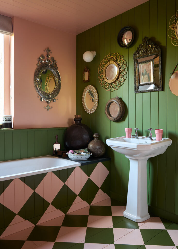 a whimsical pink and green checkerboard moves from the floor to the base of the 28