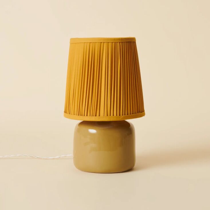 among the lighting offerings: the petite, pleated bookshelf lamp (€\240) 17