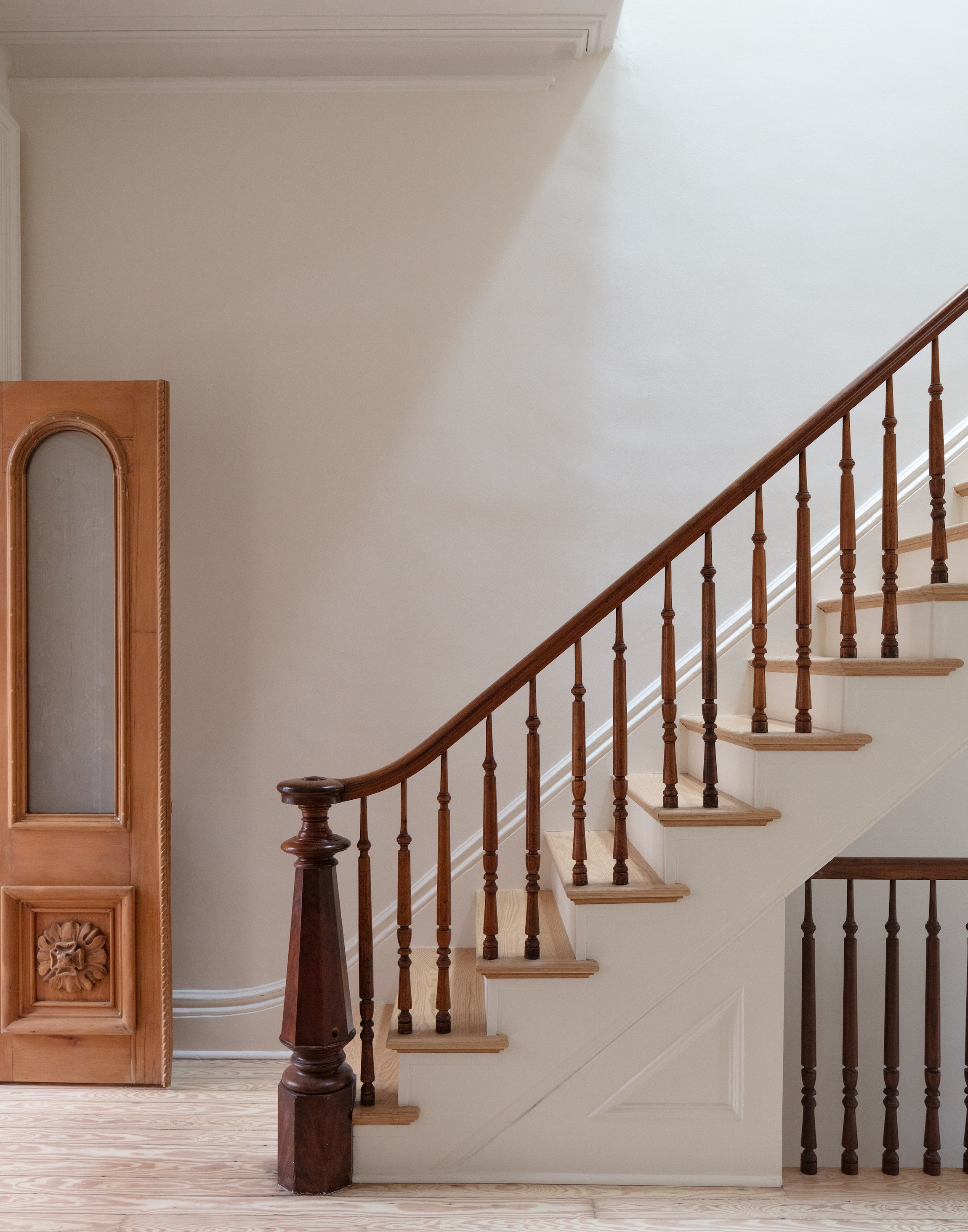 the ornate vestibule doors and main stair were refinished and repaired. note th 19