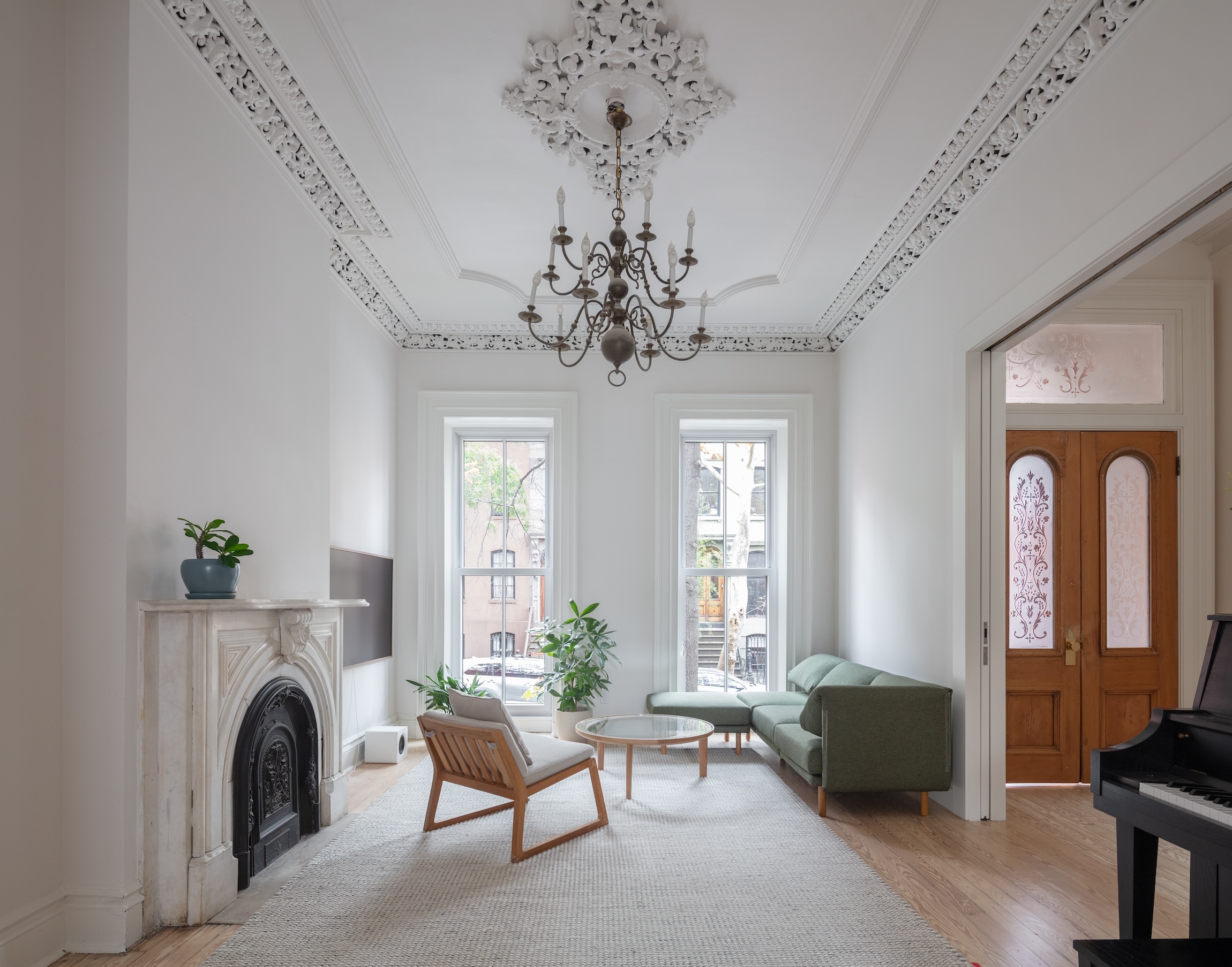 the parlor retains its marble mantel, brass chandelier, and intricate plaster m 20