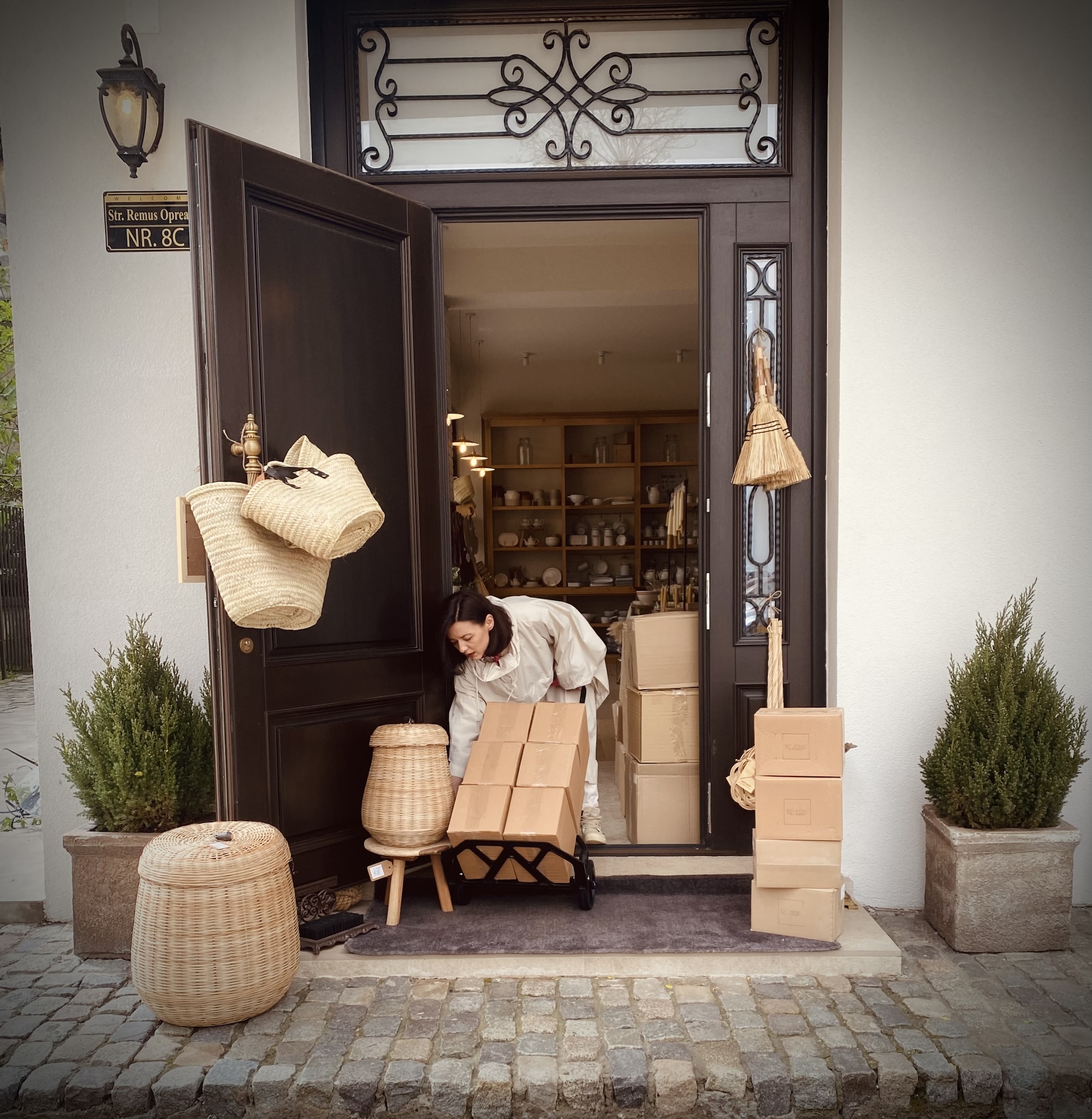 the shopkeeper at work: alexandra receives a shipment of romanian pottery. she  17