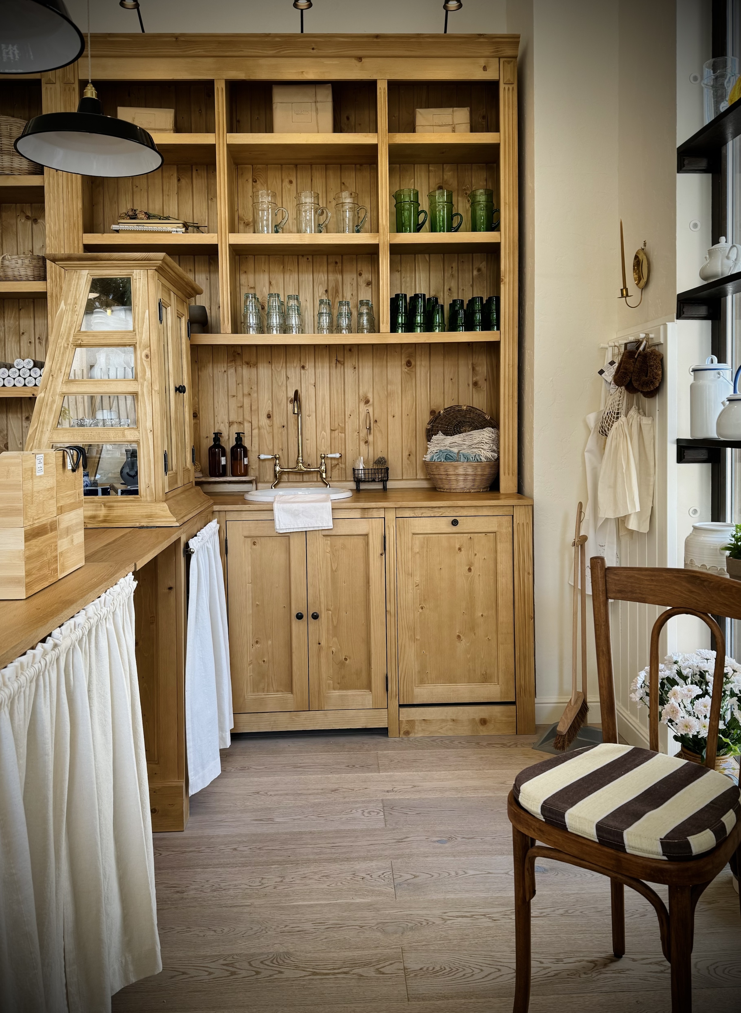 a candle sconce and sink behind the counter. above: bric à brac&#8\2\1 25