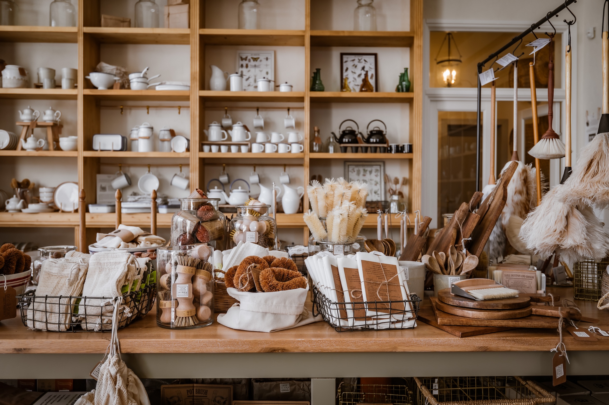 newly built open shelves and tables showcase humble, well made household goods, 18