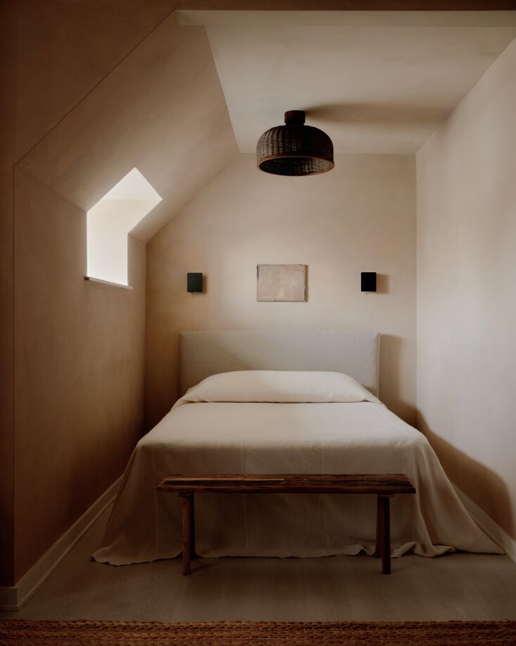 in each guest room, sebastian opted to paint the ceilings the same limewash hue 23