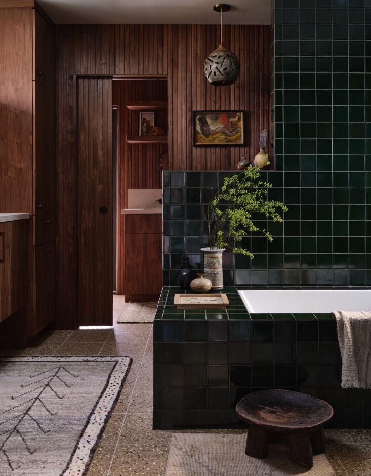 in the adjacent main bath, kirsten combined the warm paneling (finished by her  20