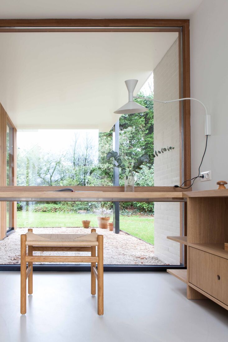 a desk with a view. the studio slow ash cabinetry speaks the same design langua 25