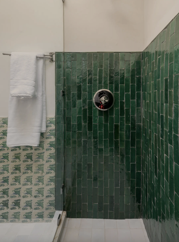 the meeting of characterful tile in the apartment shower with deep green subway 35