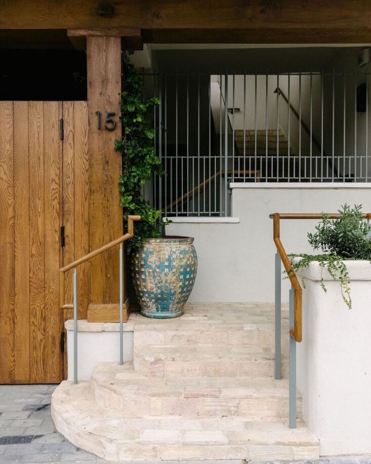 room \15 and a stairway leading to other guest rooms from the interior courtyar 18