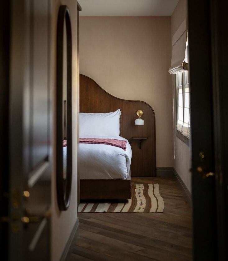 a view of the fireplace suite showcases the custom walnut headboards throughout 23