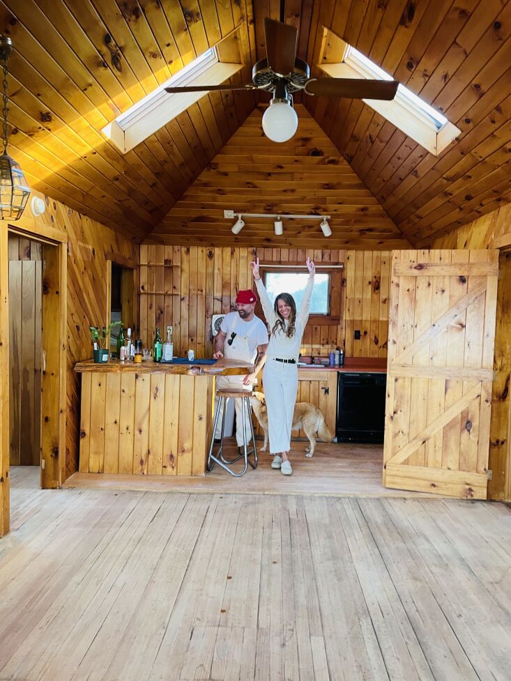 alison and jay in the kitchen, with wood floors newly revealed. 37