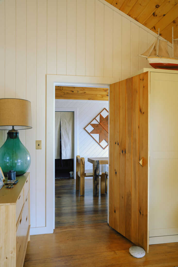 in the bedroom off of the dining area, a rock serves as doorstop. 30