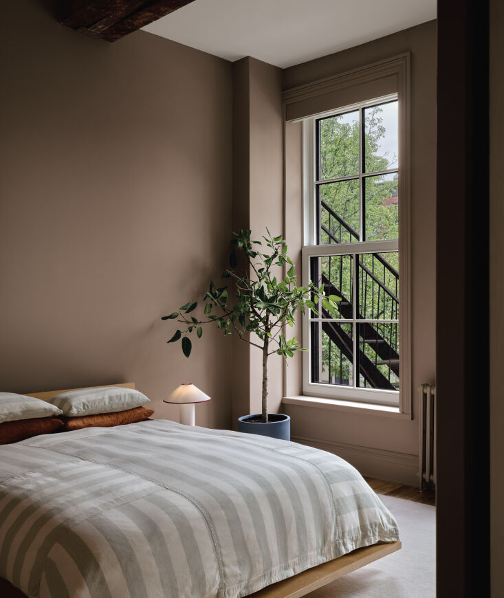 the bedroom has an extra calm and cozy vibe; unlike the walls in the rest of th 28