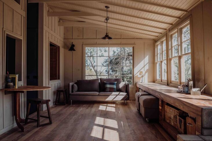 the other side of the living area. the long console serves as a dining table or 20