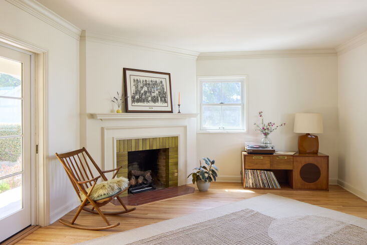 in the living room, the floors are all original red oak and walls are painted i 19