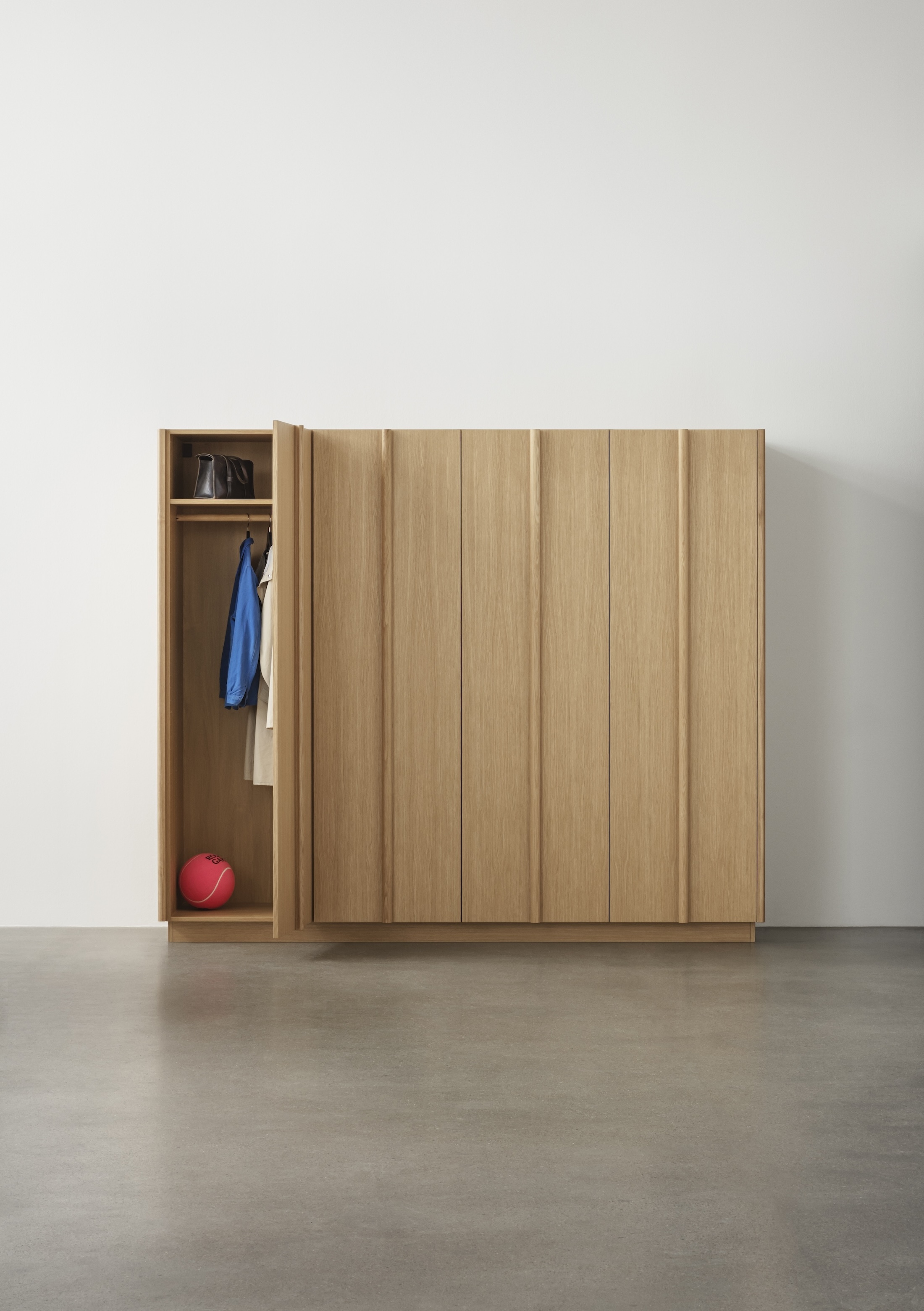 a reform wardrobe with integrated sculptural handles from its column collection 17