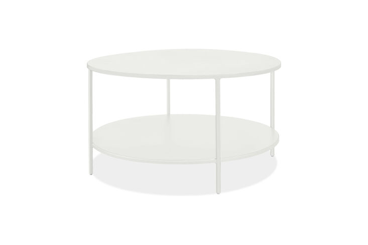 the room & board slim round coffee table starts at \$499. 26