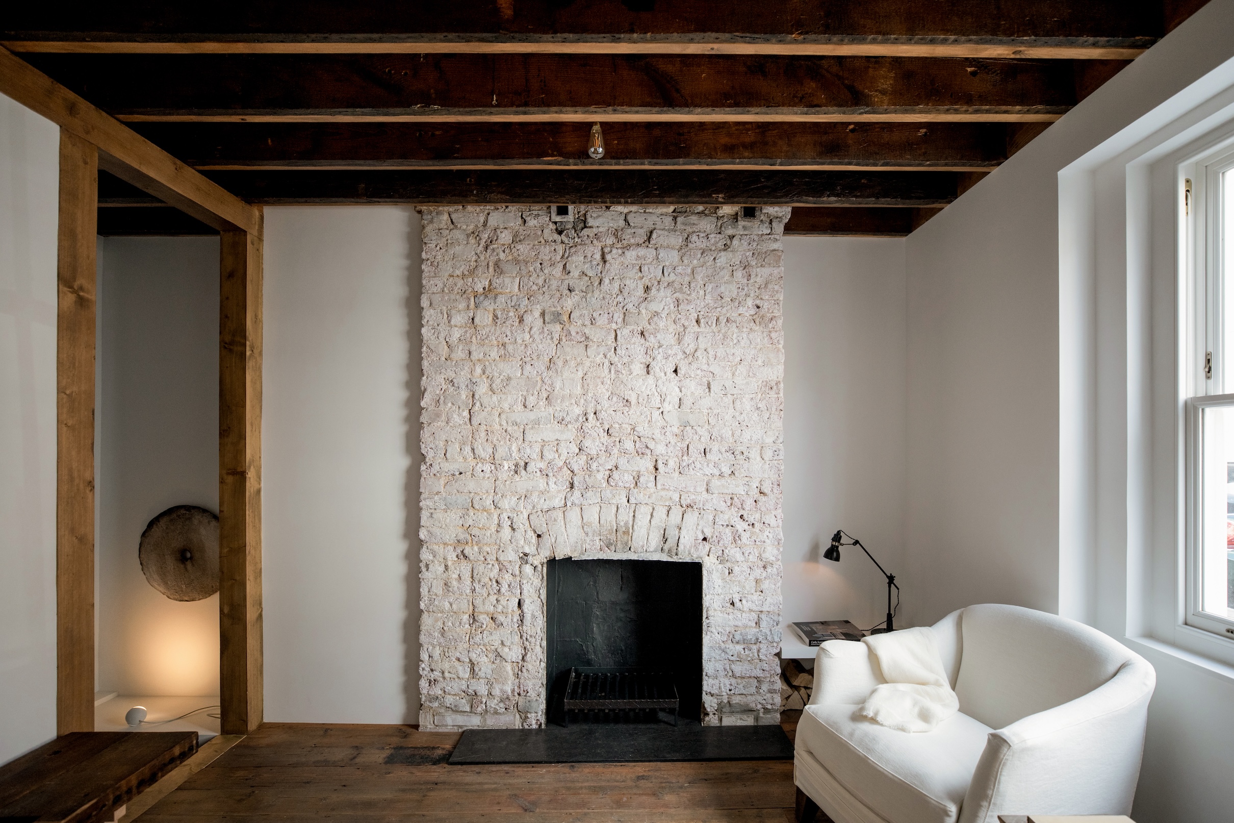 a newly exposed original chimney breast finished in limewash serves as a focal  20