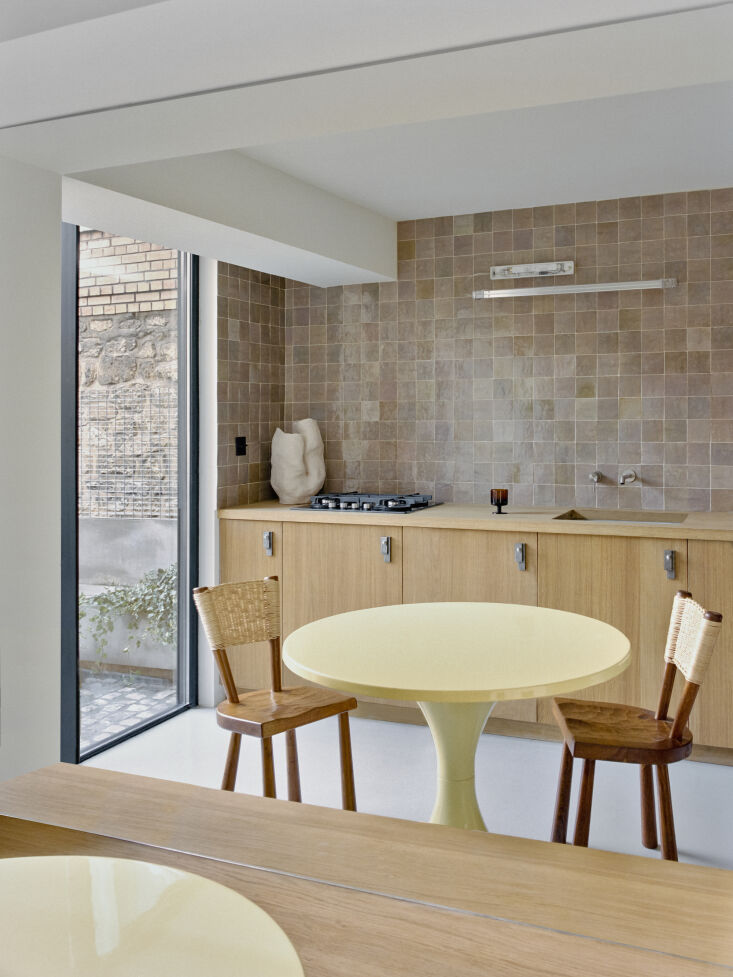 the yellow fiberglass kitchen table is by matti suuronen from \1960. the oak an 22