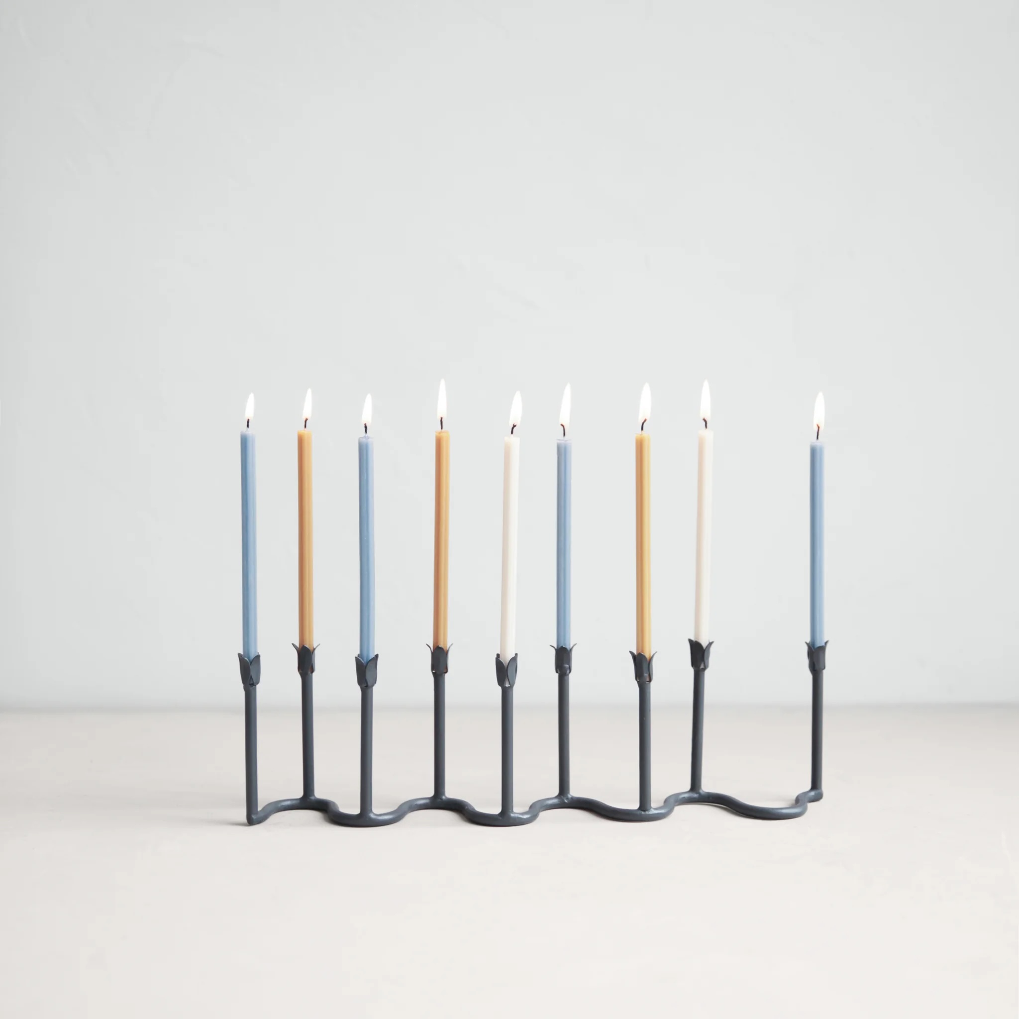 New from The Floral Society, TFS&#8\2\17;s own Beacon Menorah of hand-forged wrought-iron with tulip candle cups; \$7\1.