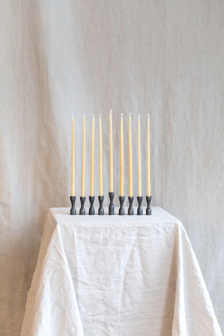 At Hoppe Shoppe, a favorite browsing spot in Portland, Oregon, this Forged Iron Modern Menorah; \$98, recently sold out but at our request was restocked. The eight matte-finished candleholders can be used in a range of configurations.