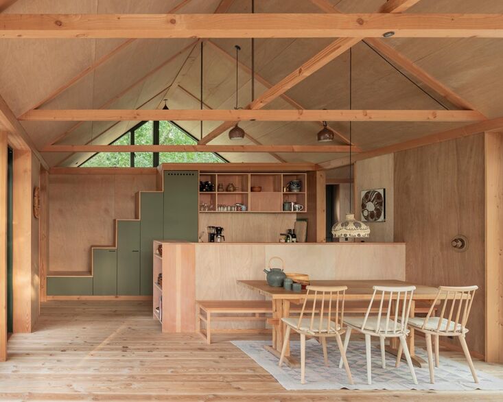 the house is situated with sunlight in mind: the kitchen, dining, and living ar 19