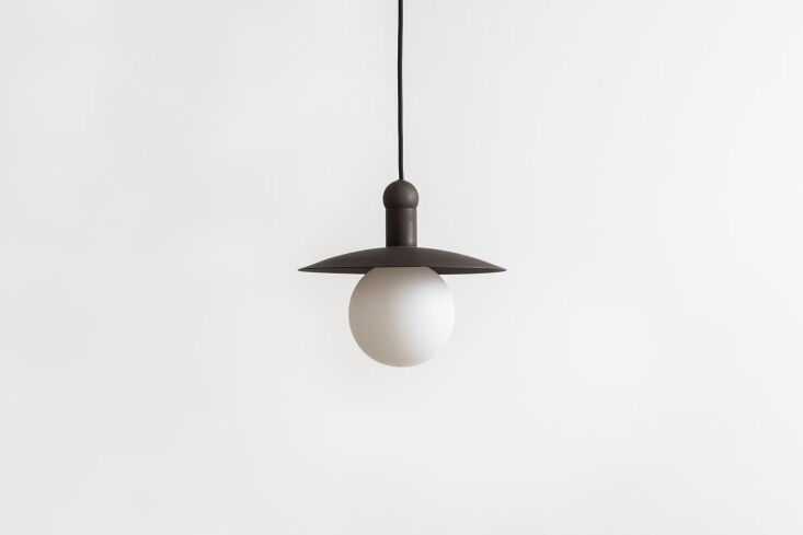 hung from a short cord in the mudroom, the workstead helios cord pendant in han 25