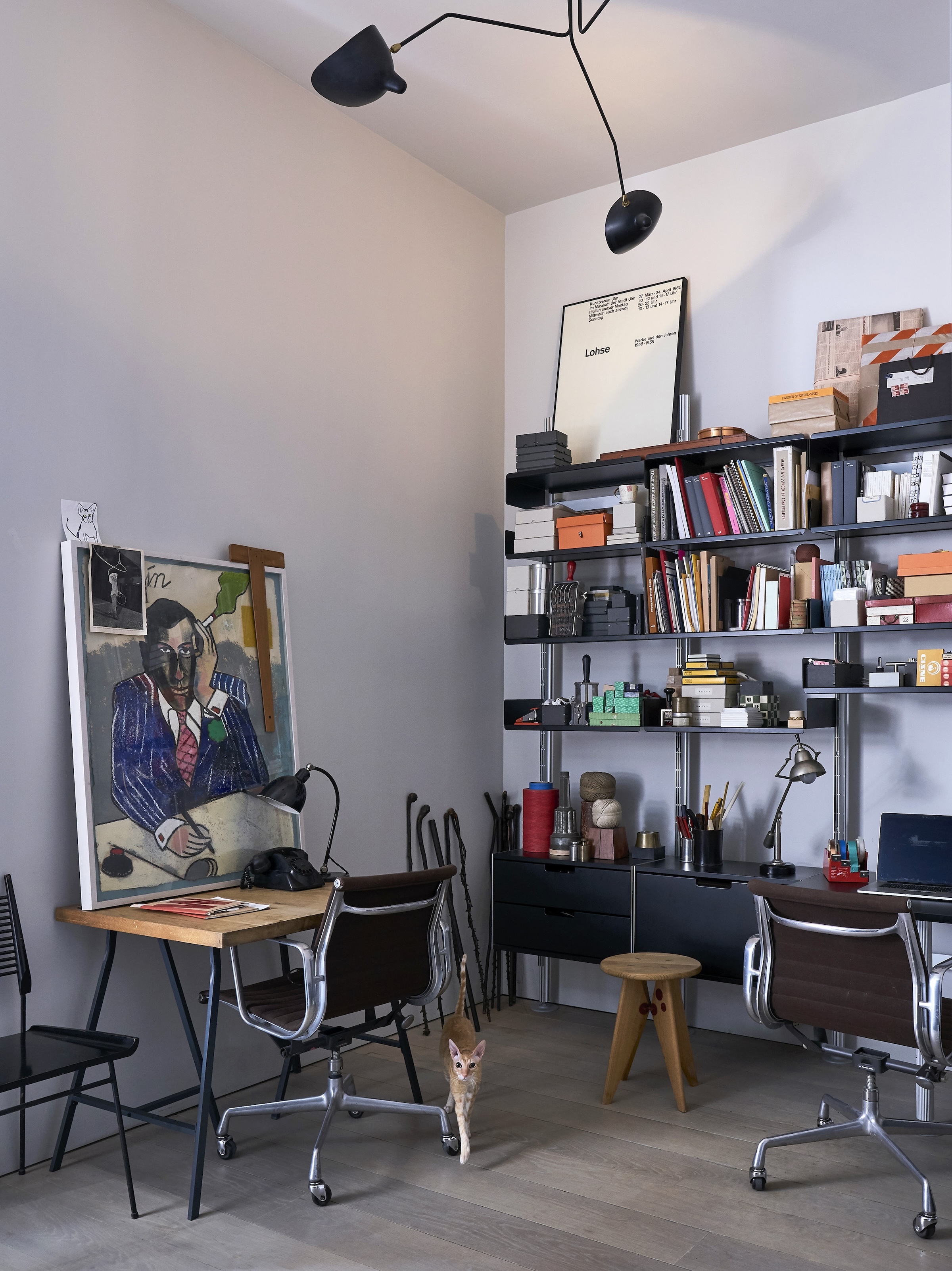 the office is furnished with vitsoe shelving and vintage eames desk chairs. the 32