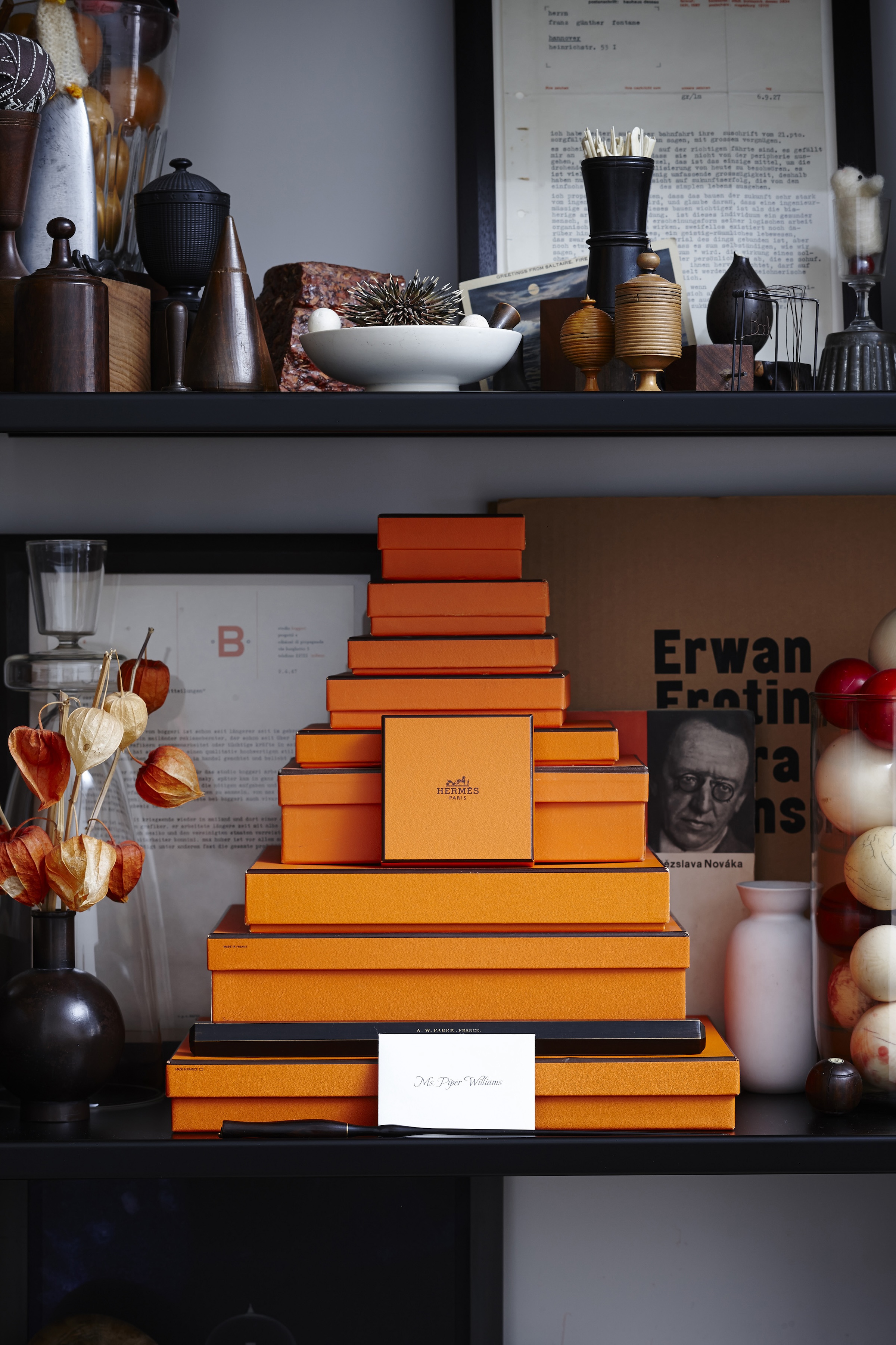 a pyramid of hermès boxes, a display that doubles as storage. photograph b 27