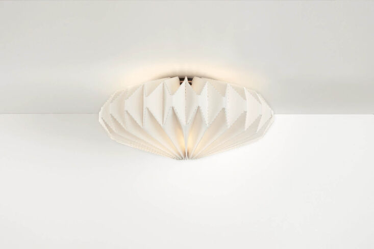 the room & board orikata ceiling light is made of cotton fabric and inspire 22