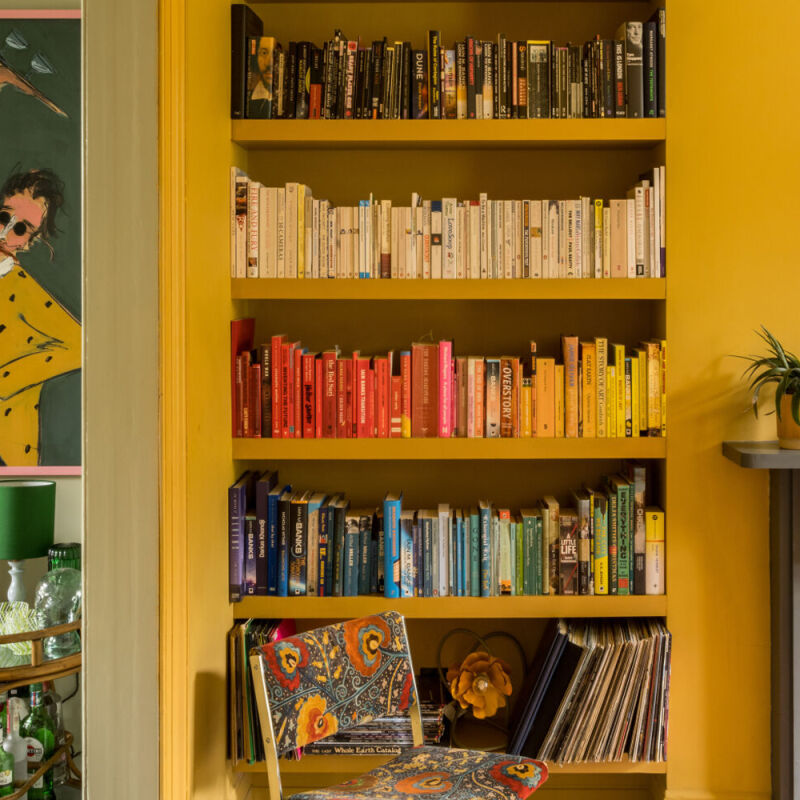 tonal terrace bvds architects french and tye colvestone crescent dalston hackney yellow books bookshelf greent timber floor fireplace grey cover  